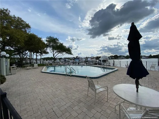 a view of a garden with lawn chairs