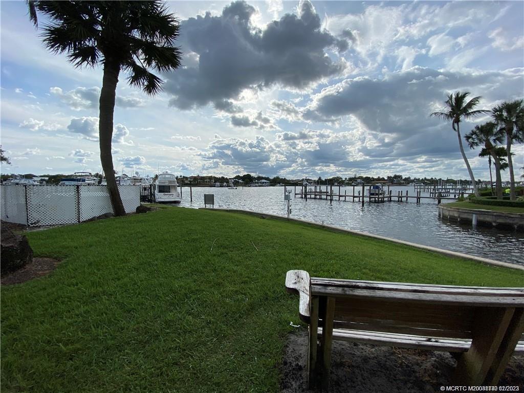 3901 Southeast St Lucie Boulevard, Unit D29 Stuart, FL 34997 - Photo 25 of 26 a view of a garden with lawn chairs