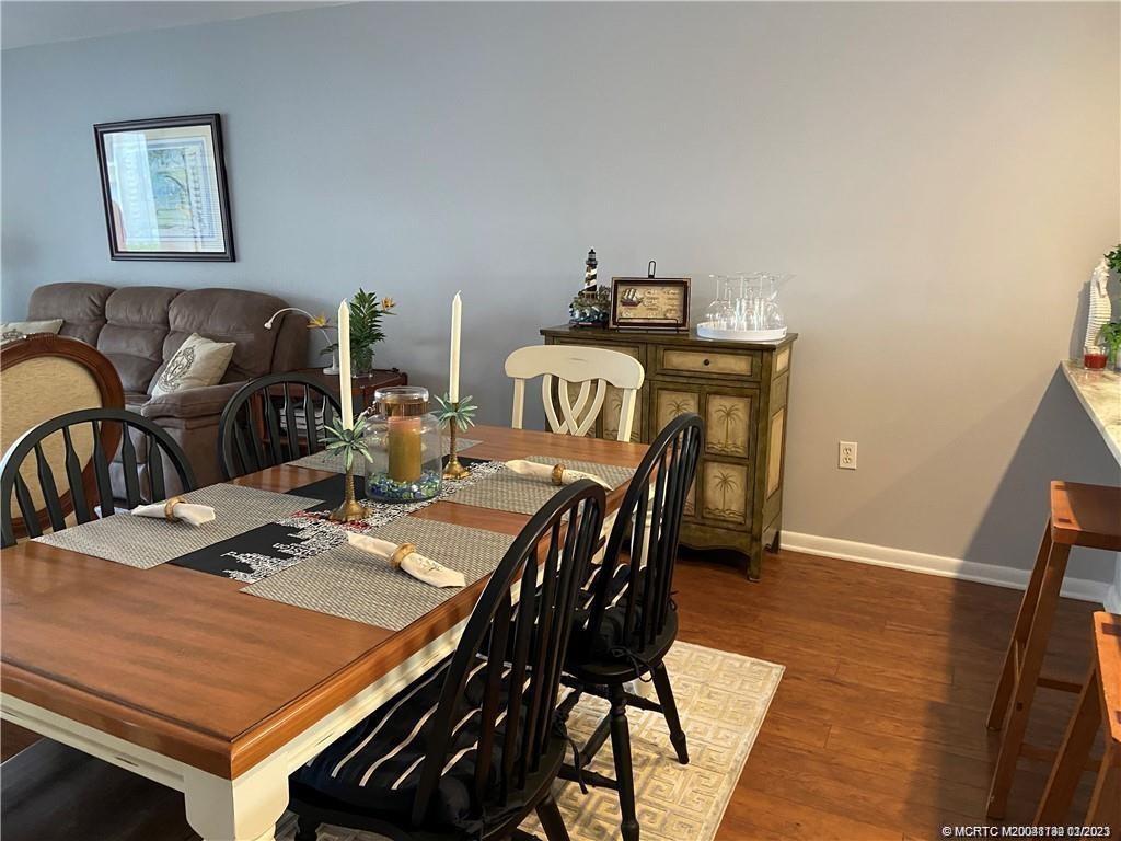 3901 Southeast St Lucie Boulevard, Unit D29 Stuart, FL 34997 - Photo 6 of 26 a view of a dining room with furniture