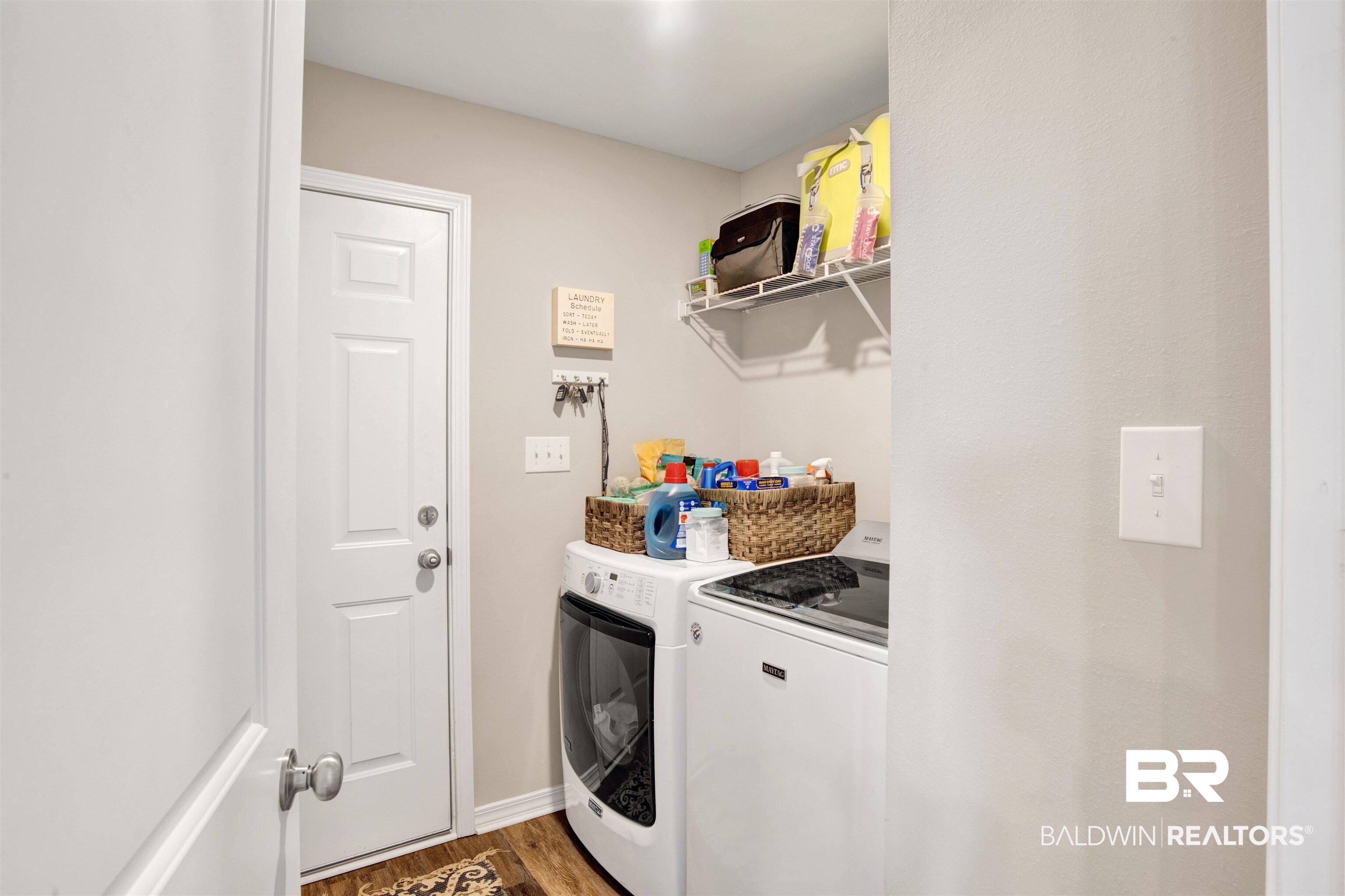 3097 Ingrid Lane Foley, AL 36535 - Photo 24 of 38 Laundry area featuring wood-type flooring and washer and dryer