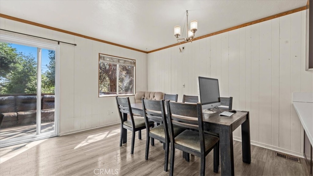 31347 Circle View Drive Running Springs, CA 92382 - Photo 11 of 48 a view of a dining room with furniture window and wooden floor
