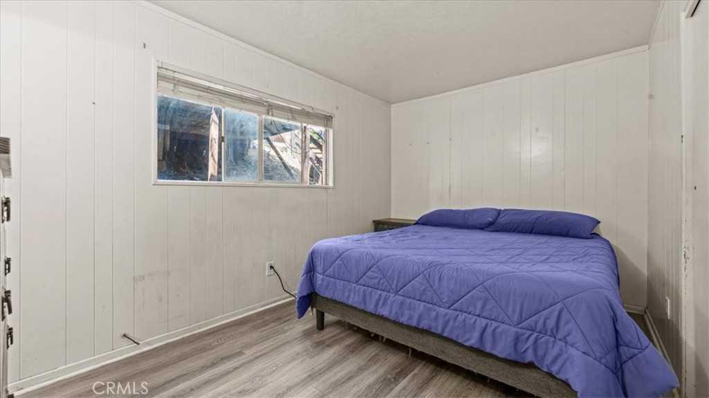 31347 Circle View Drive Running Springs, CA 92382 - Photo 16 of 48 a bed sitting in a bedroom next to a window