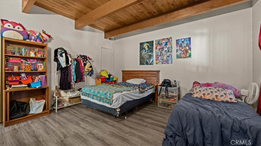 31347 Circle View Drive Running Springs, CA 92382 - Photo 20 of 48 a bedroom with furniture and a baby crib