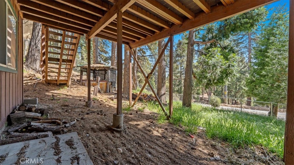 31347 Circle View Drive Running Springs, CA 92382 - Photo 27 of 48 a backyard of a house with lots of green space