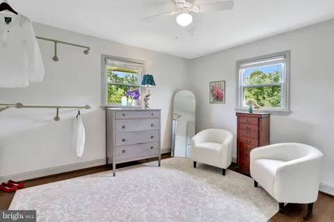 a bedroom with furniture and a window