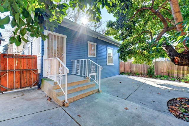 a view of backyard with a deck