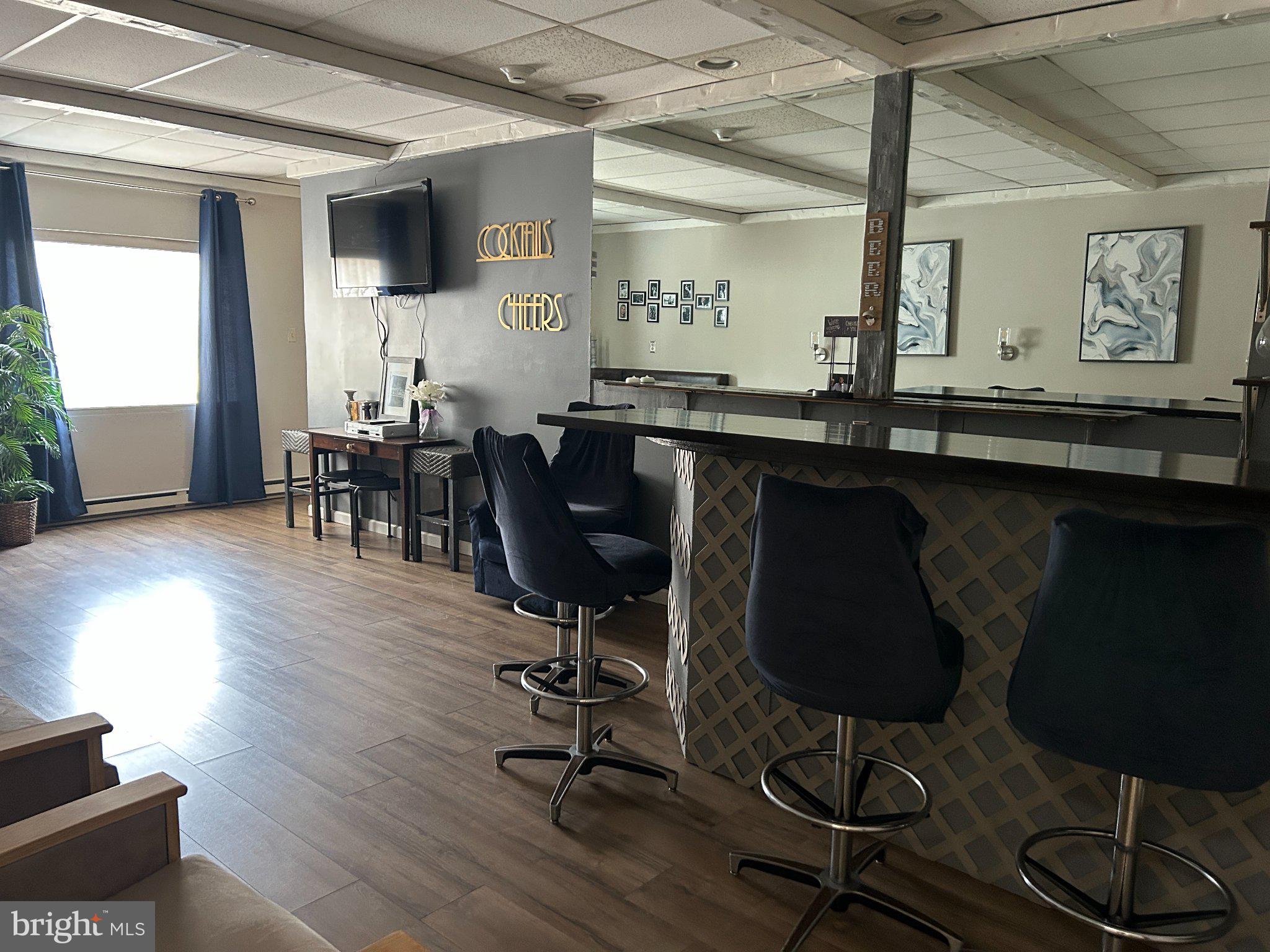 860 Lower Ferry Road, Unit 6M Ewing, NJ 08628 - Photo 16 of 16 a view of a workspace with furniture and a window