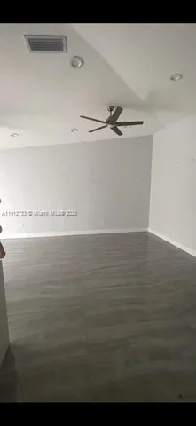 a view of a room with an empty space