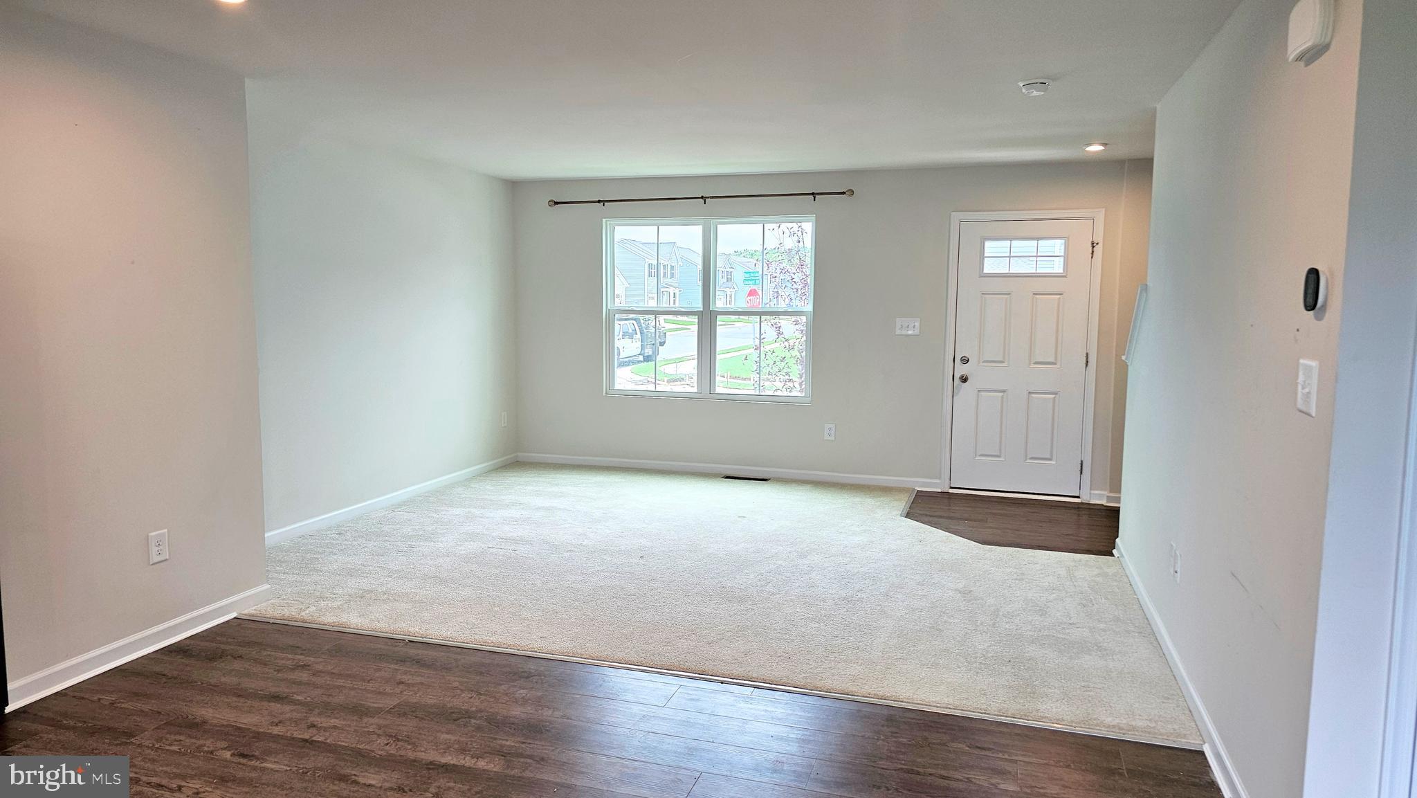 11 Orchard Road Seaford, DE 19973 - Photo 25 of 76 an empty room with wooden floor and windows