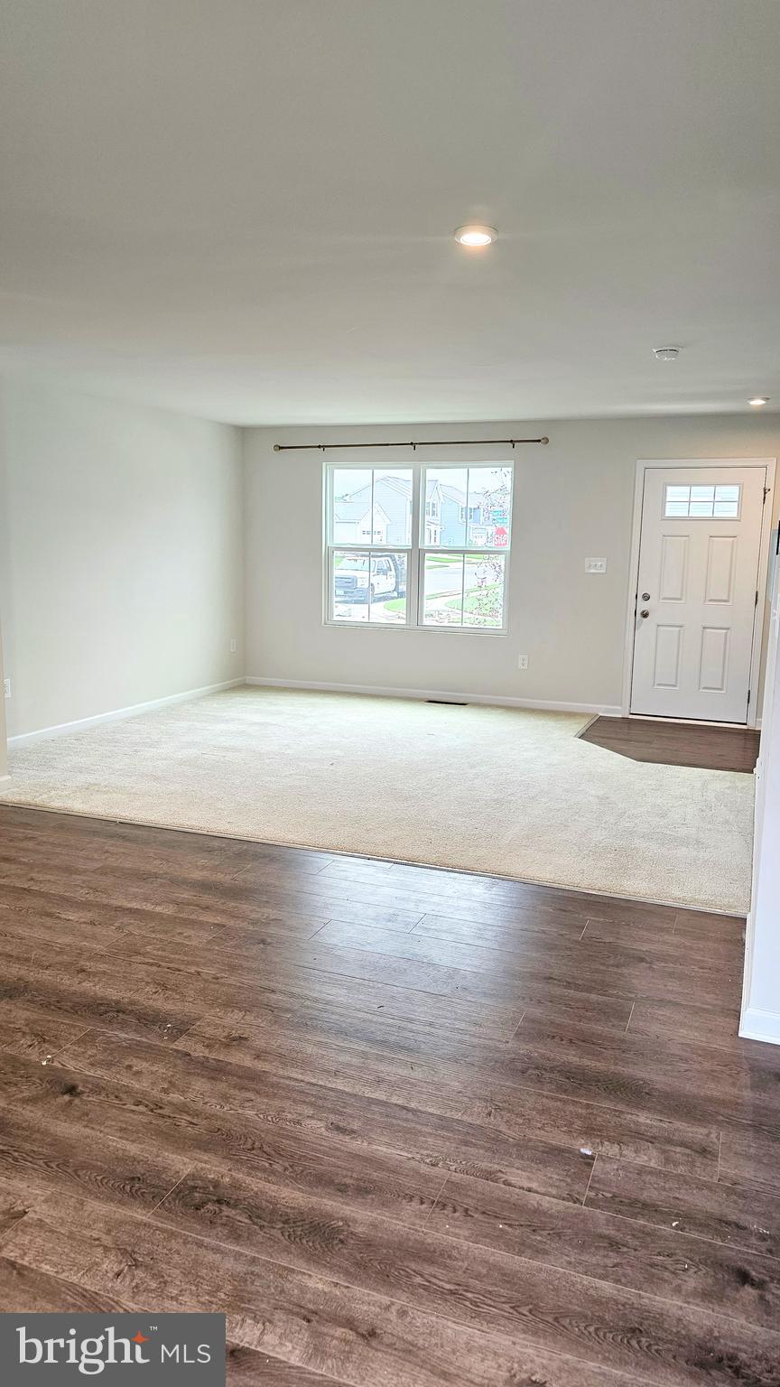 11 Orchard Road Seaford, DE 19973 - Photo 26 of 76 a view of an empty room with window and wooden floor