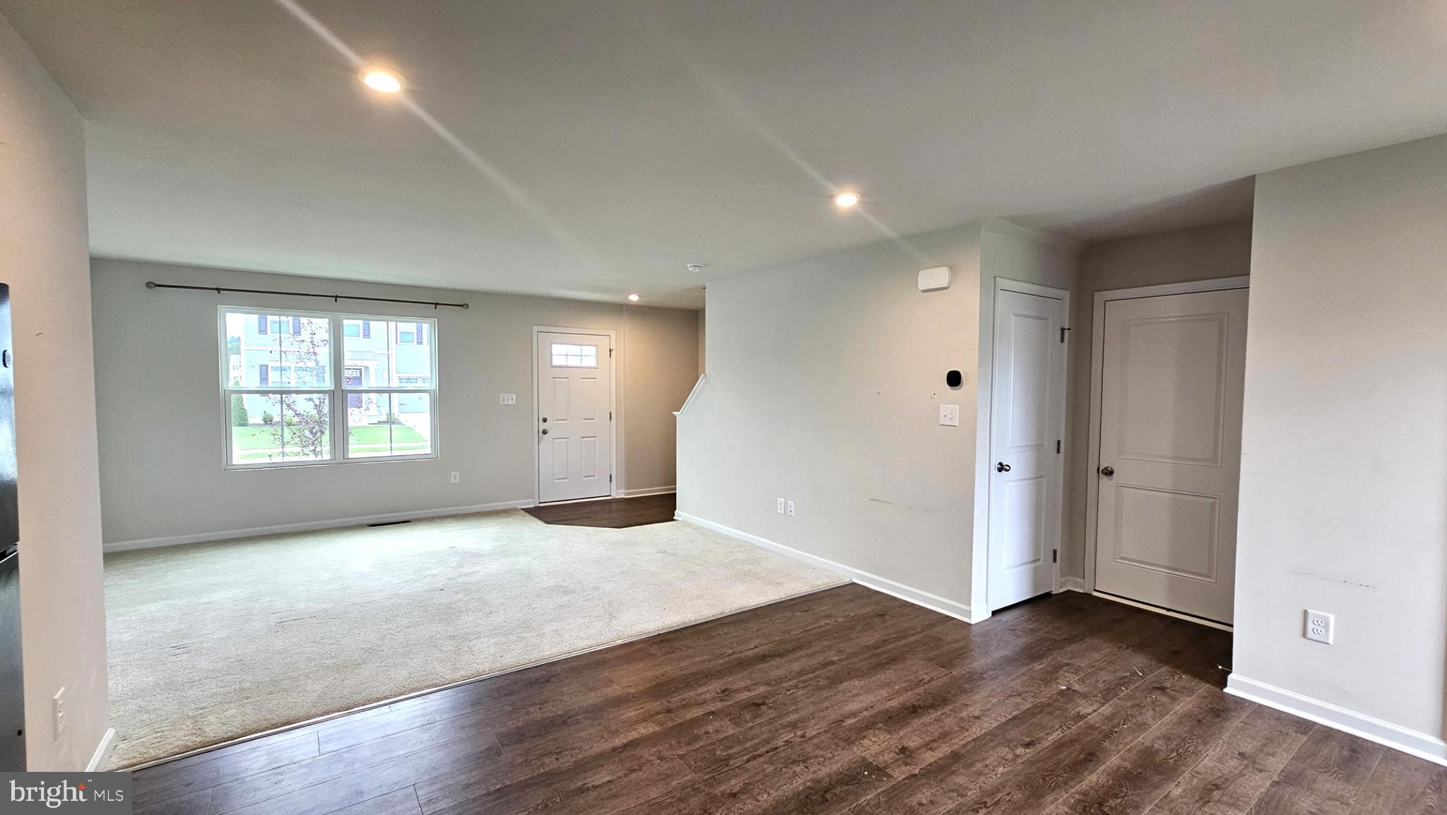 11 Orchard Road Seaford, DE 19973 - Photo 29 of 76 an empty room with wooden floor and windows