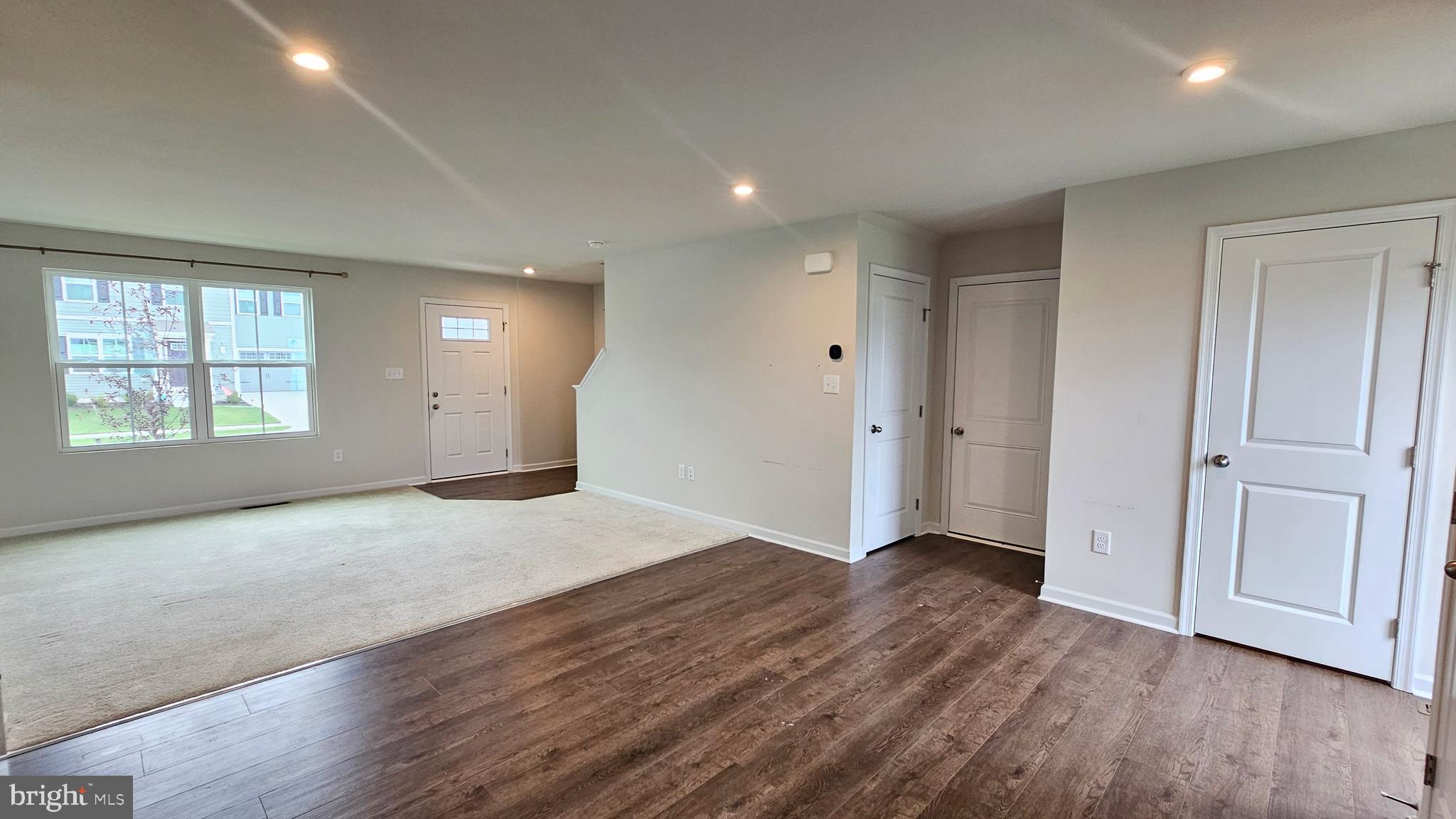 11 Orchard Road Seaford, DE 19973 - Photo 30 of 76 an empty room with wooden floor cabinet and windows