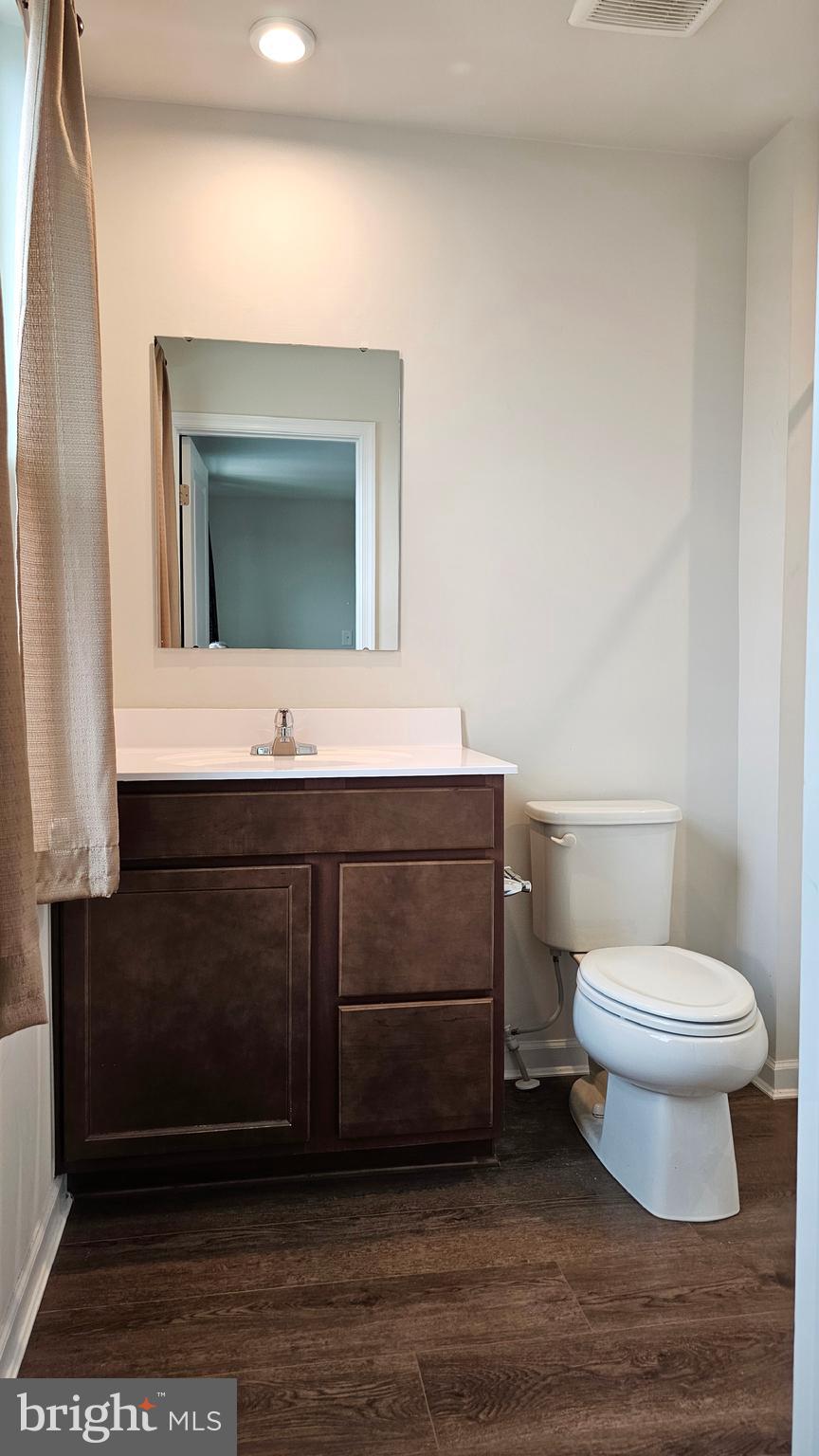 11 Orchard Road Seaford, DE 19973 - Photo 39 of 76 a bathroom with a sink a toilet and mirror