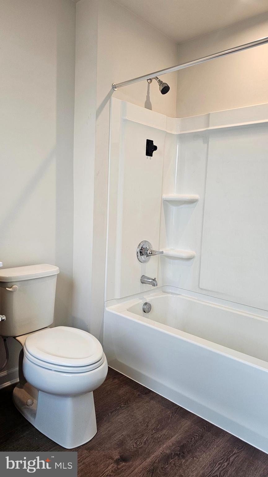 11 Orchard Road Seaford, DE 19973 - Photo 40 of 76 a white toilet sitting next to a bath tub