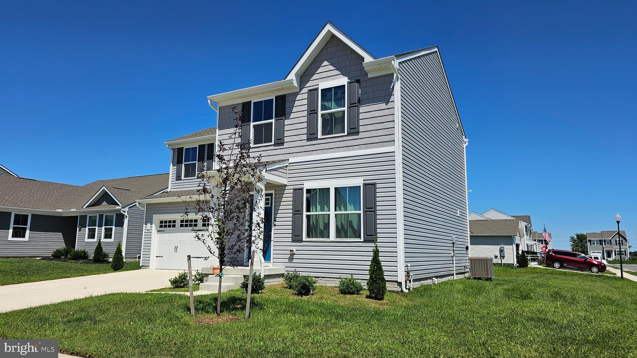 11 Orchard Road Seaford, DE 19973 - Photo 4 of 76 a front view of a house with a garden and plants