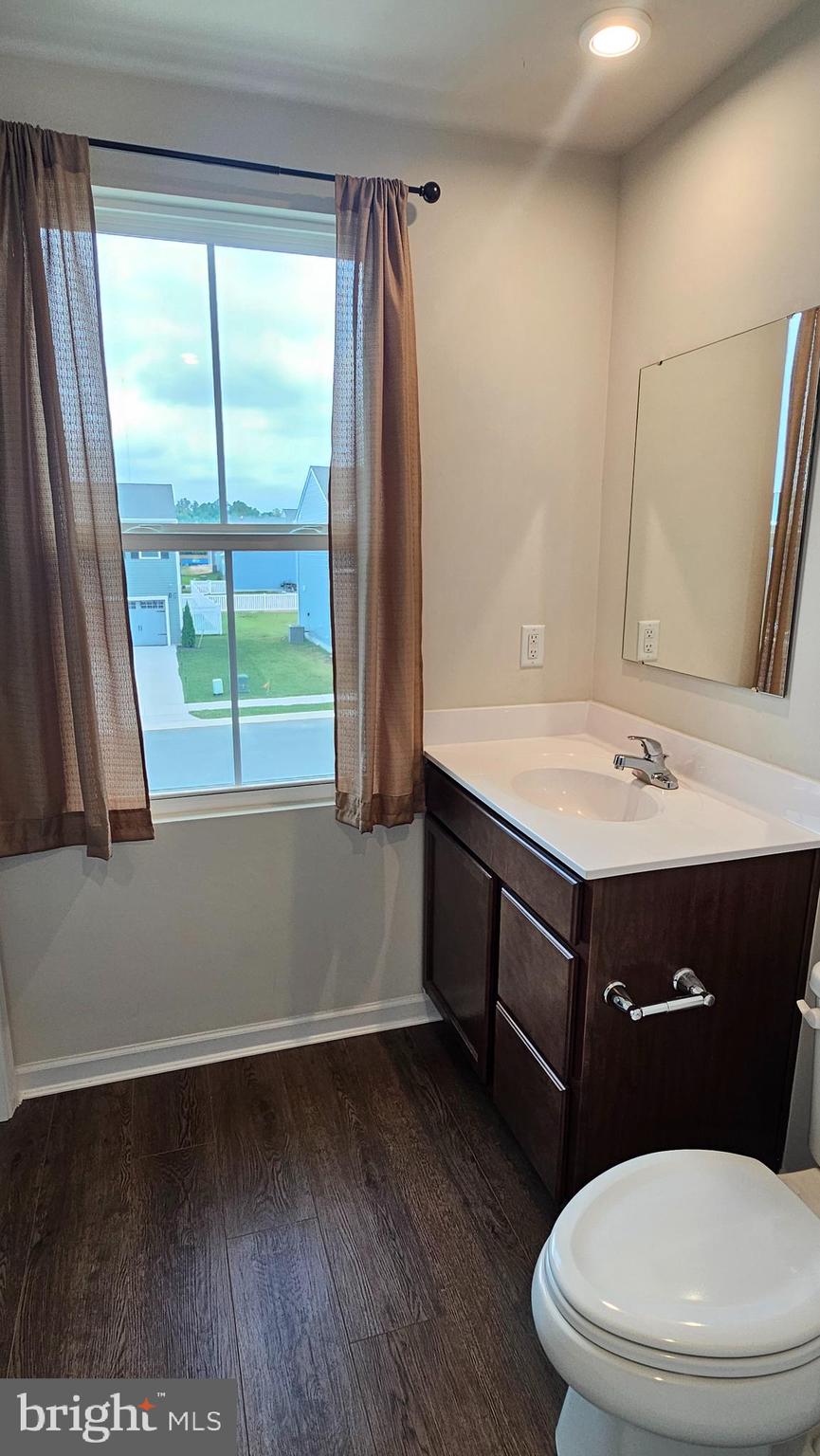 11 Orchard Road Seaford, DE 19973 - Photo 42 of 76 a bathroom with a sink a toilet and a mirror