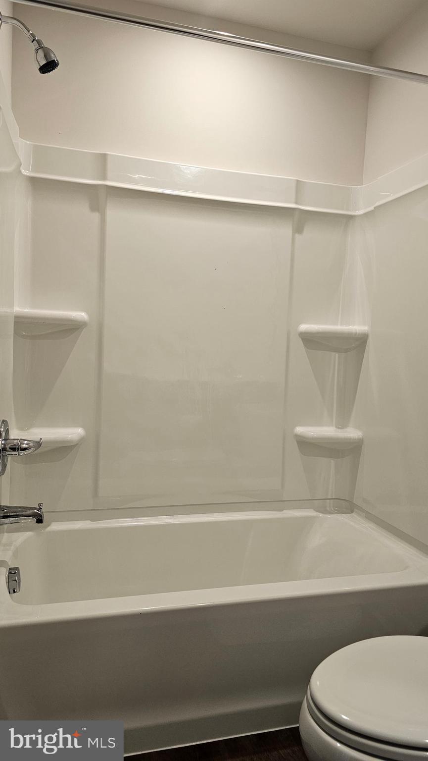 11 Orchard Road Seaford, DE 19973 - Photo 46 of 76 a bathroom with a bathtub and a shower