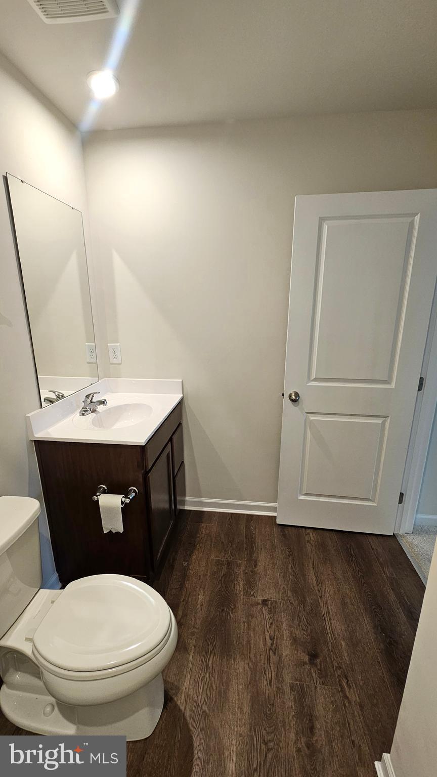 11 Orchard Road Seaford, DE 19973 - Photo 47 of 76 a bathroom with a sink a toilet and mirror