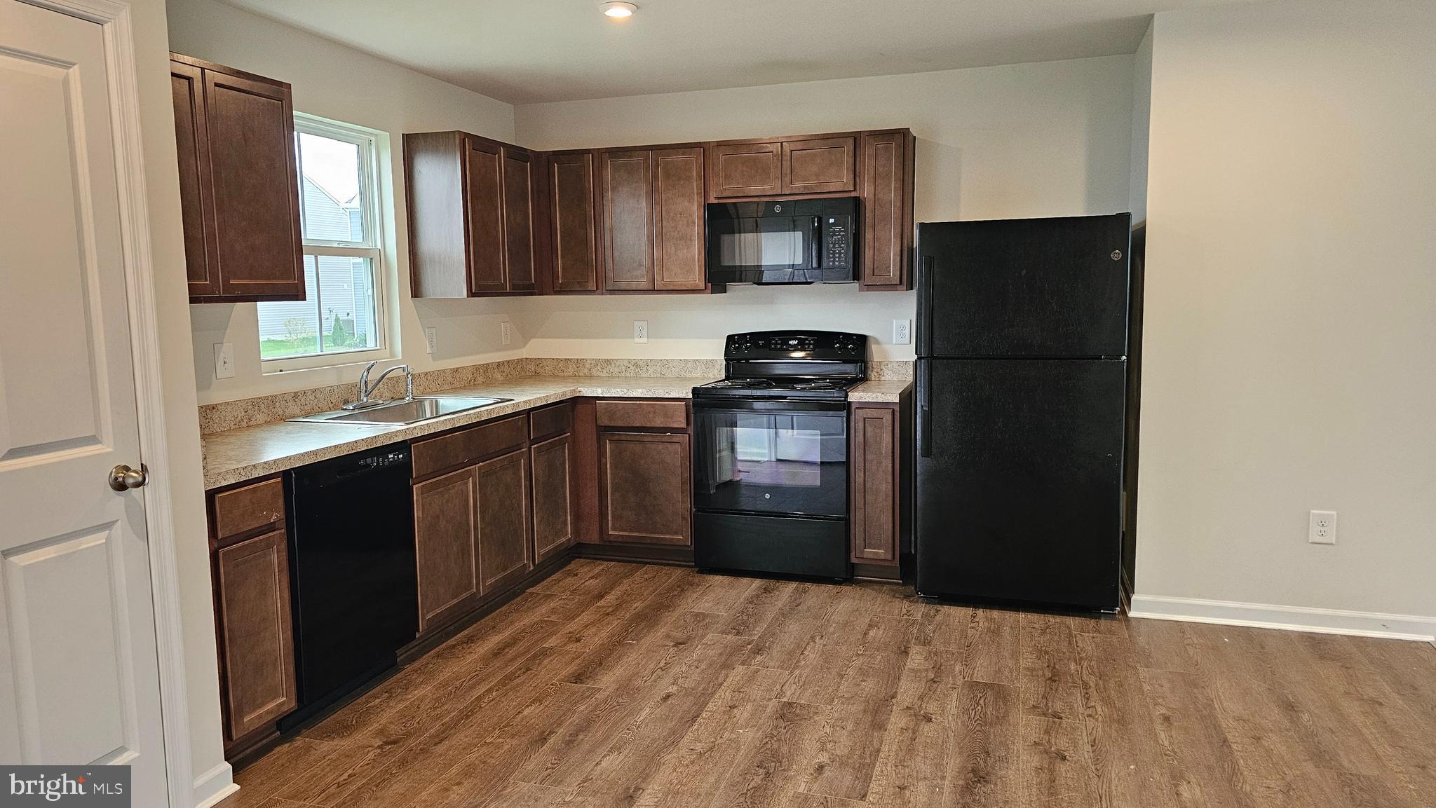 11 Orchard Road Seaford, DE 19973 - Photo 55 of 76 a kitchen with stainless steel appliances granite countertop a refrigerator and a sink