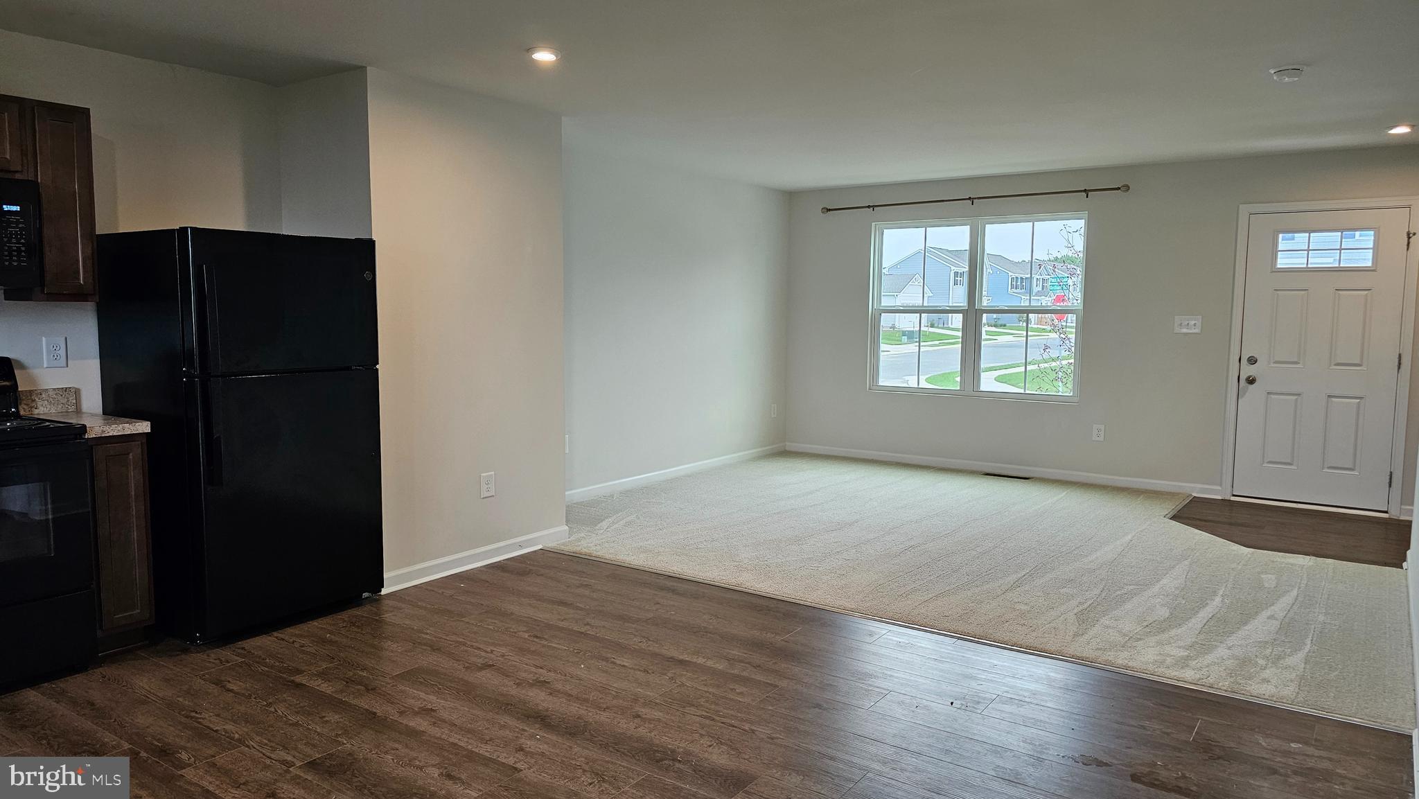 11 Orchard Road Seaford, DE 19973 - Photo 57 of 76 an empty room with wooden floor cabinet and windows
