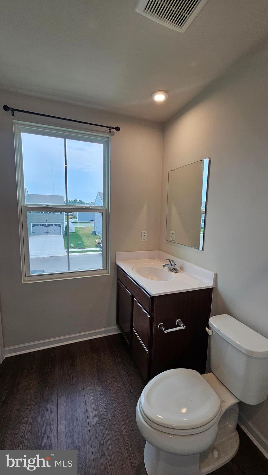 11 Orchard Road Seaford, DE 19973 - Photo 64 of 76 a bathroom with a toilet a sink and a window