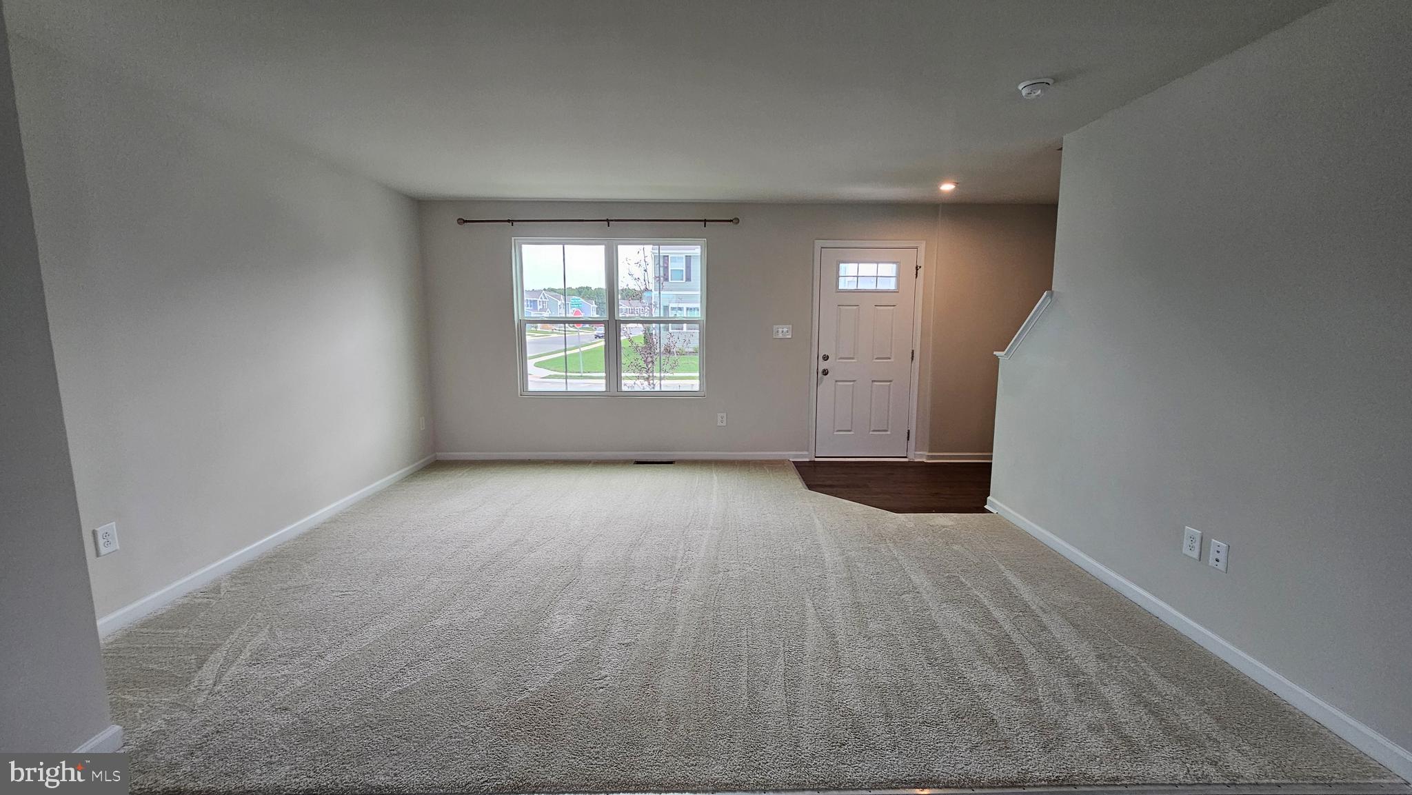 11 Orchard Road Seaford, DE 19973 - Photo 73 of 76 an empty room with wooden floor and windows