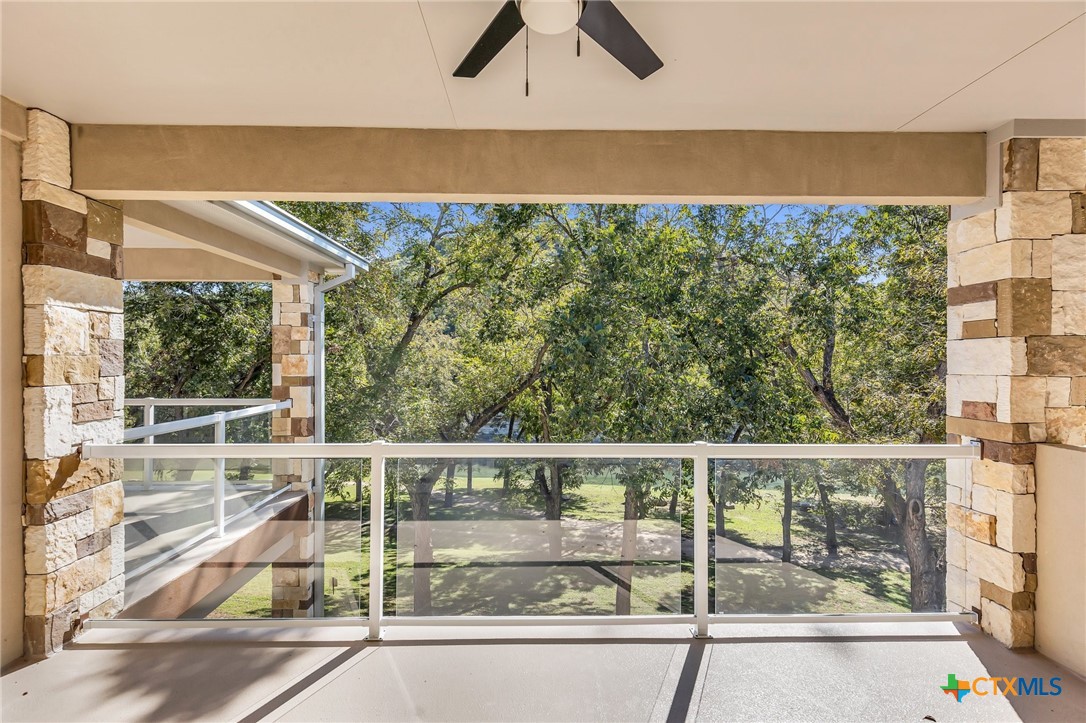 540 River Run, Unit 314 New Braunfels, TX 78132 - Photo 12 of 15 a view of a balcony with lake view and a floor to ceiling window