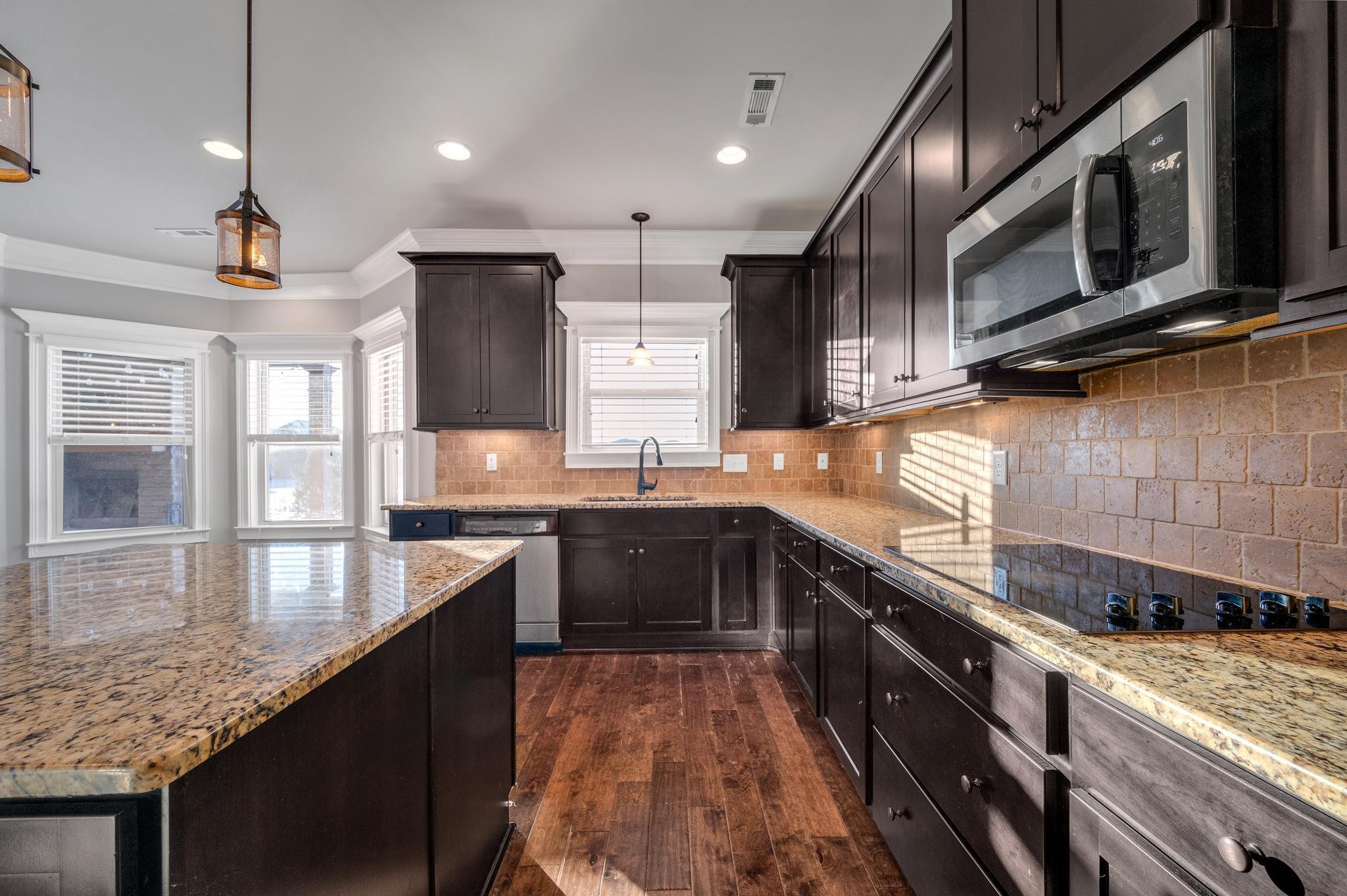 236 McClaran Place Murfreesboro, TN 37129 - Photo 11 of 48 a large kitchen with stainless steel appliances granite countertop a sink a stove and a wooden cabinets