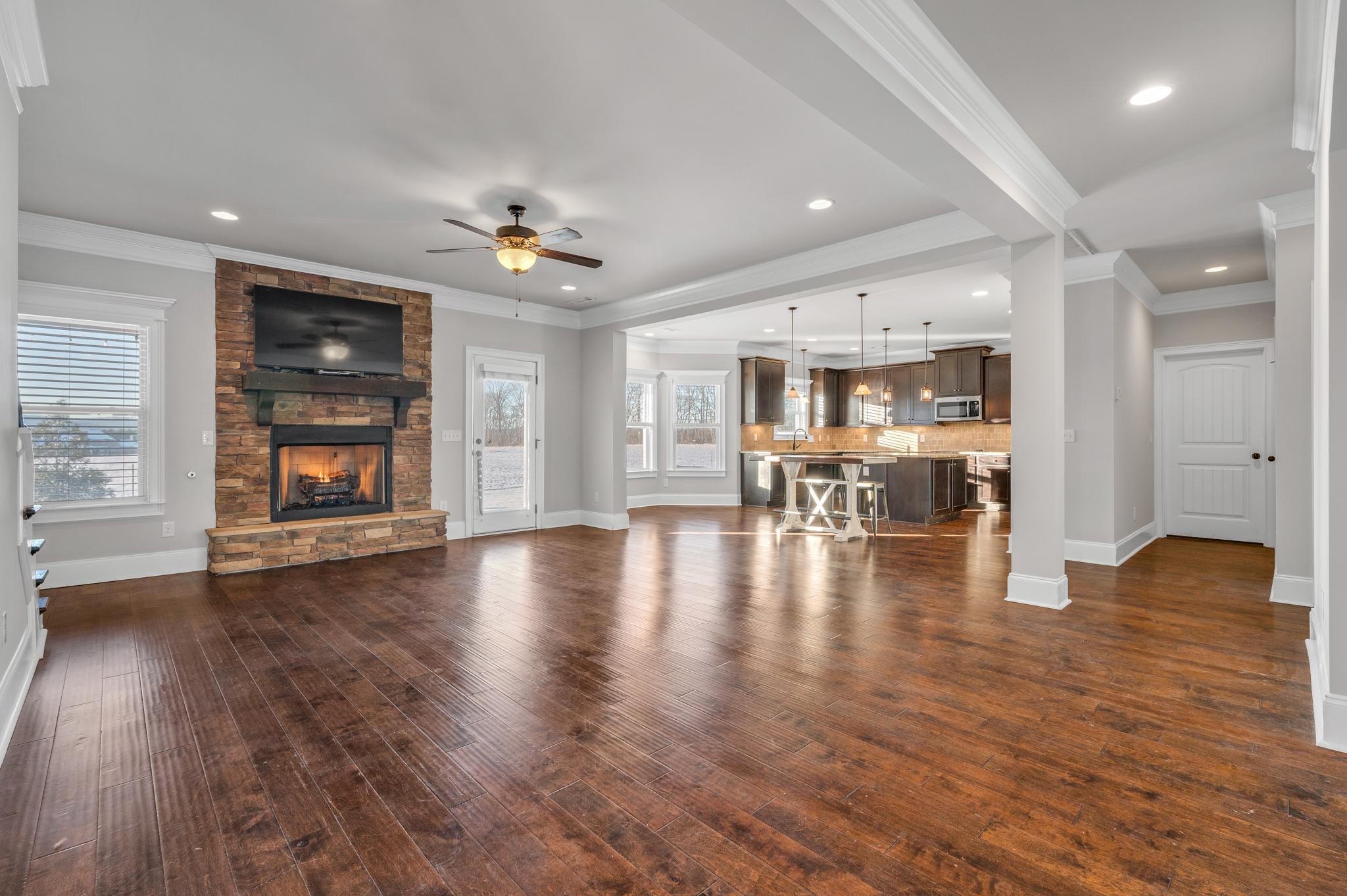 236 McClaran Place Murfreesboro, TN 37129 - Photo 2 of 48 an empty room with wooden floor fireplace and windows