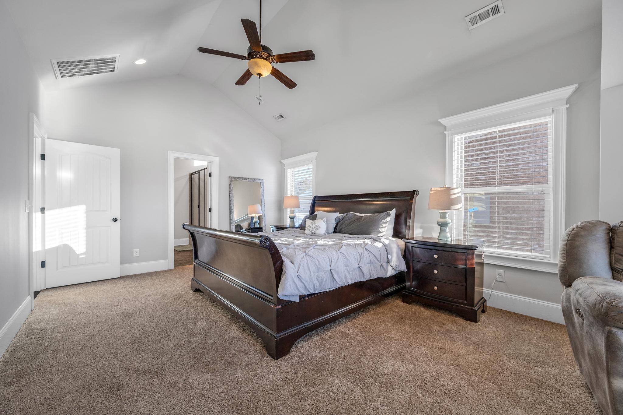 236 McClaran Place Murfreesboro, TN 37129 - Photo 21 of 48 a spacious bedroom with a bed couch and window