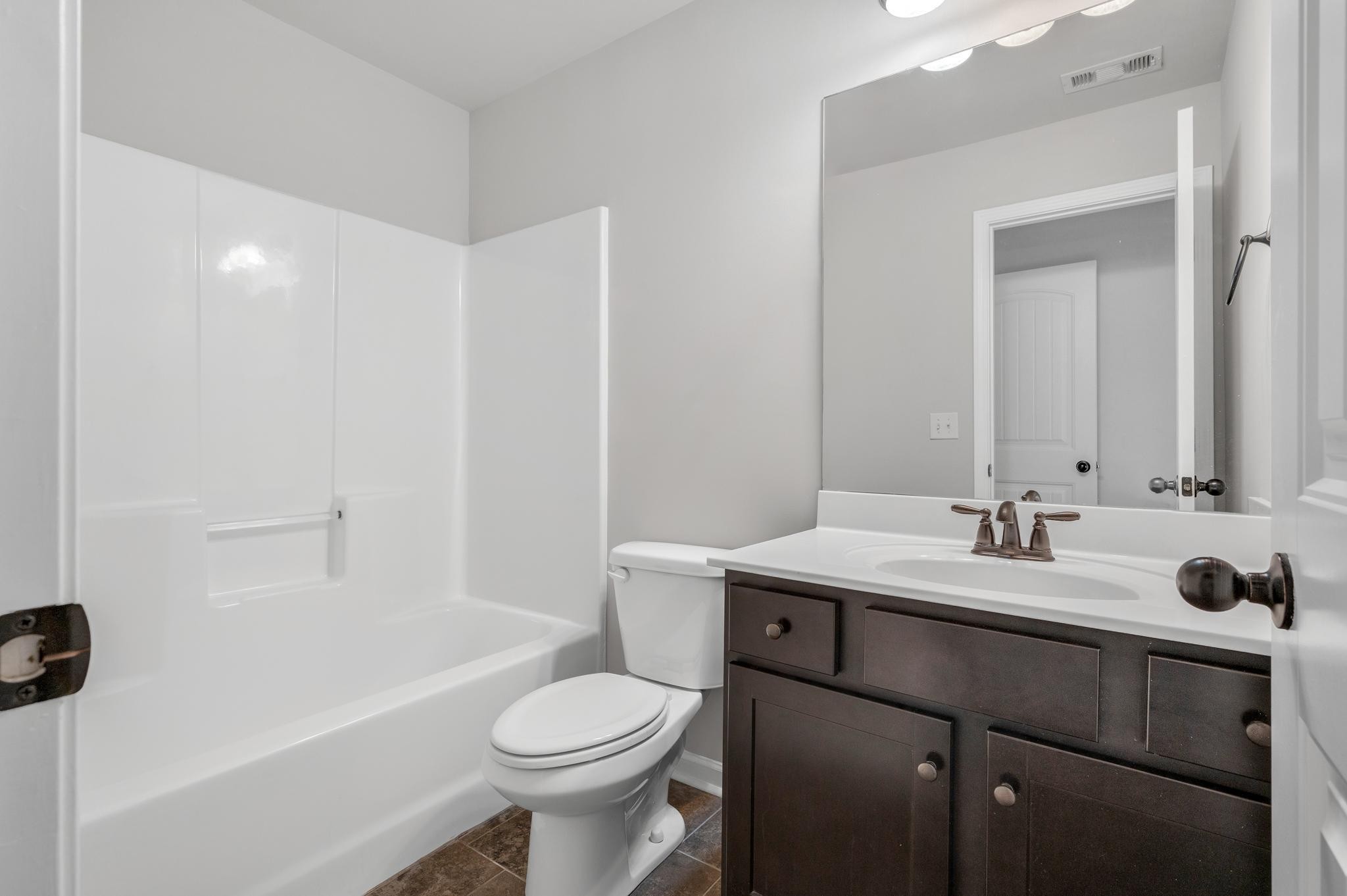 236 McClaran Place Murfreesboro, TN 37129 - Photo 35 of 48 a bathroom with a sink a toilet and shower