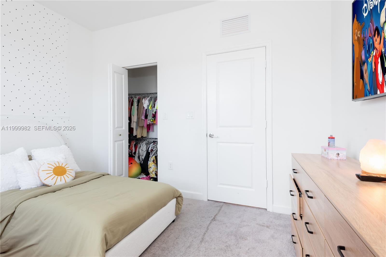 9949 Southwest 228th Terrace Miami, FL 33190 - Photo 24 of 40 a bedroom with a bed and a closet