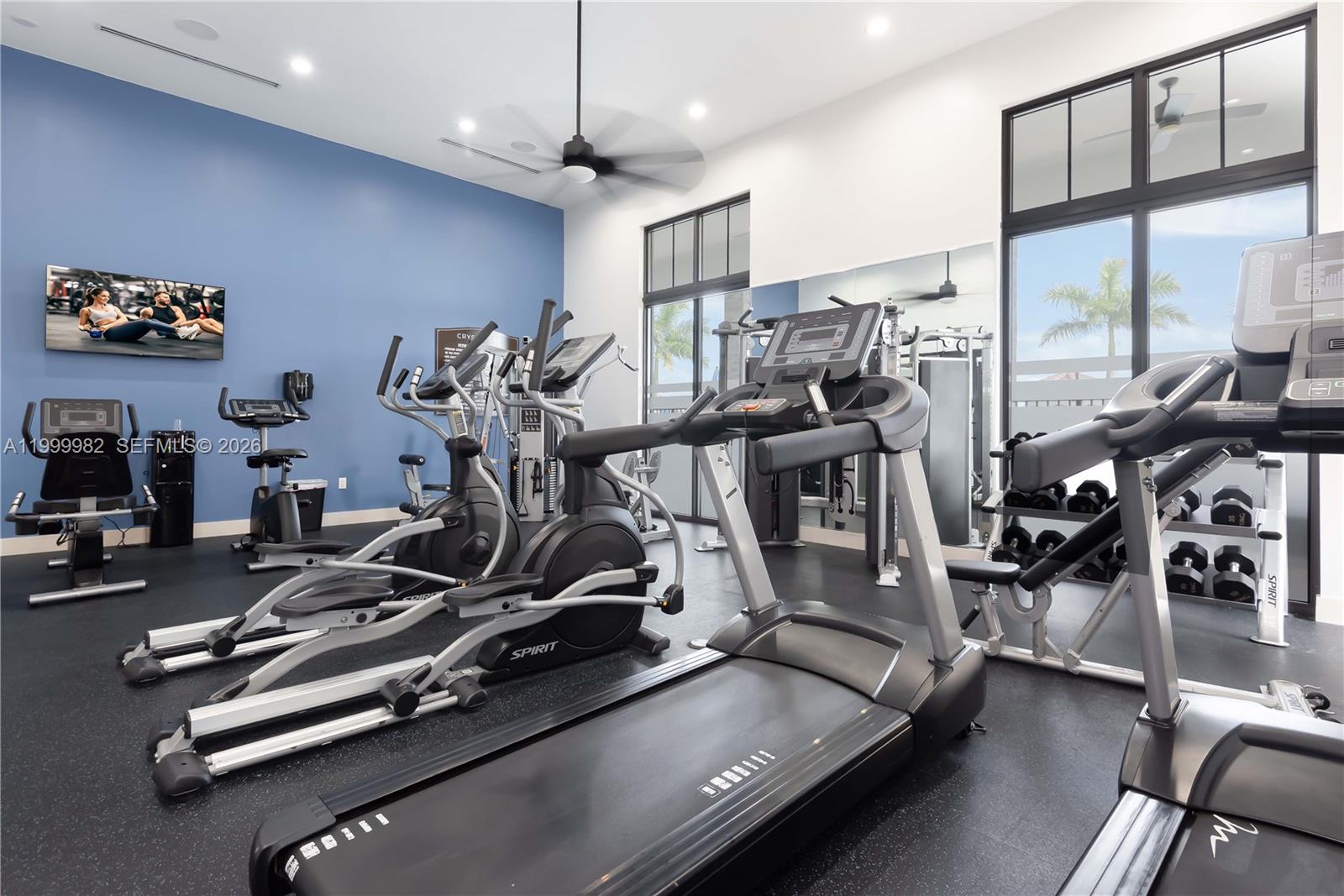 9949 Southwest 228th Terrace Miami, FL 33190 - Photo 35 of 40 a view of a room with gym equipment