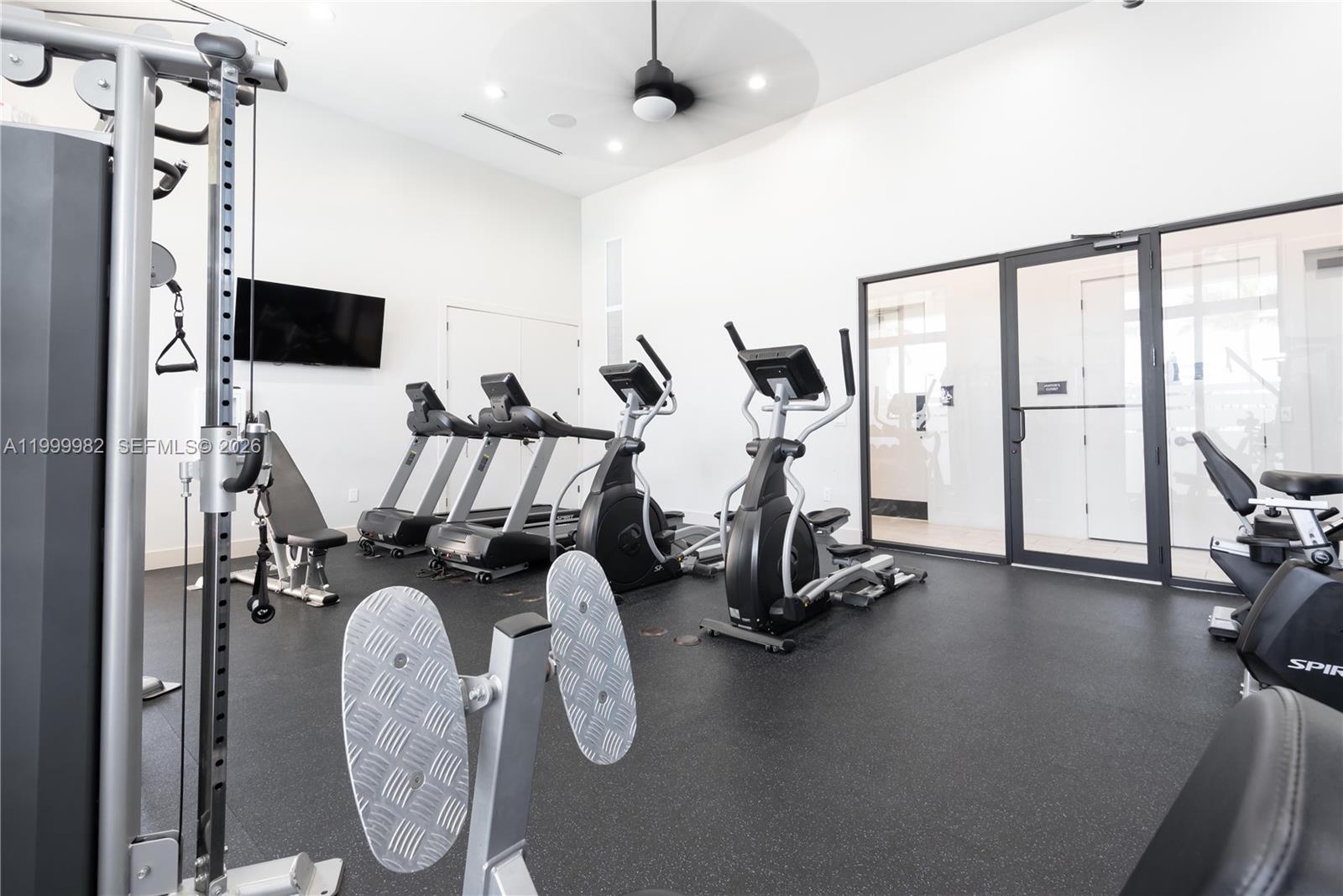 9949 Southwest 228th Terrace Miami, FL 33190 - Photo 36 of 40 a view of a room with gym equipment