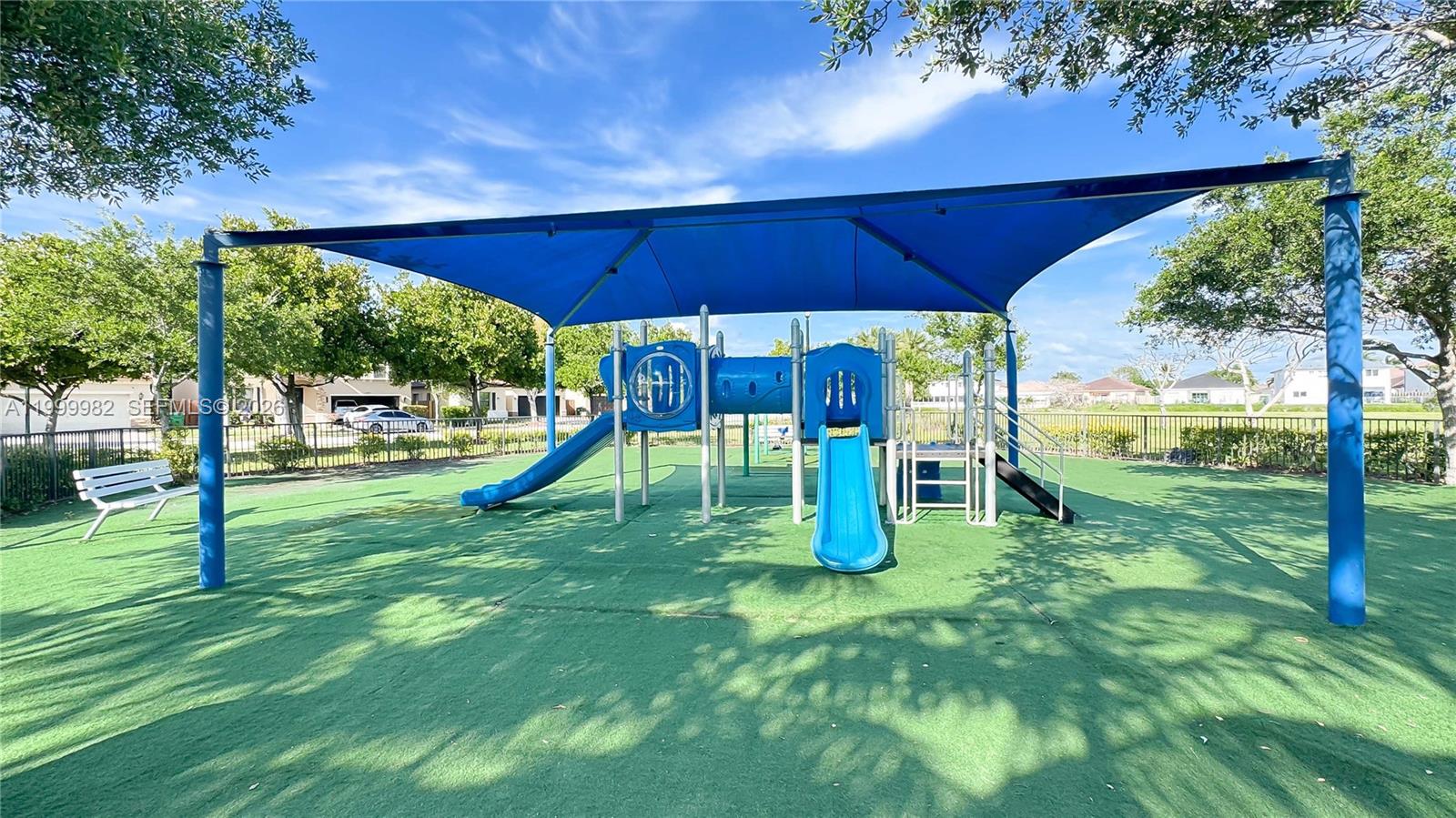 9949 Southwest 228th Terrace Miami, FL 33190 - Photo 39 of 40 a view of a park with slide