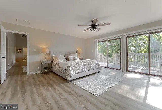 a view of a garden with a lake and a sign board