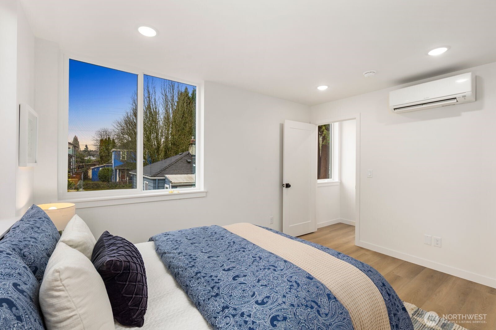 806 South Rose Street Seattle, WA 98108 - Photo 11 of 20 a bedroom with a bed and a large window