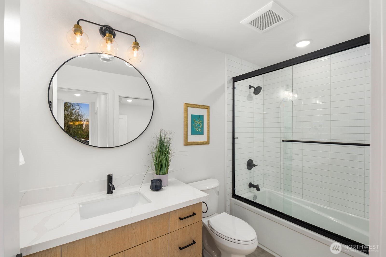 806 South Rose Street Seattle, WA 98108 - Photo 12 of 20 a bathroom with a toilet a sink and a mirror