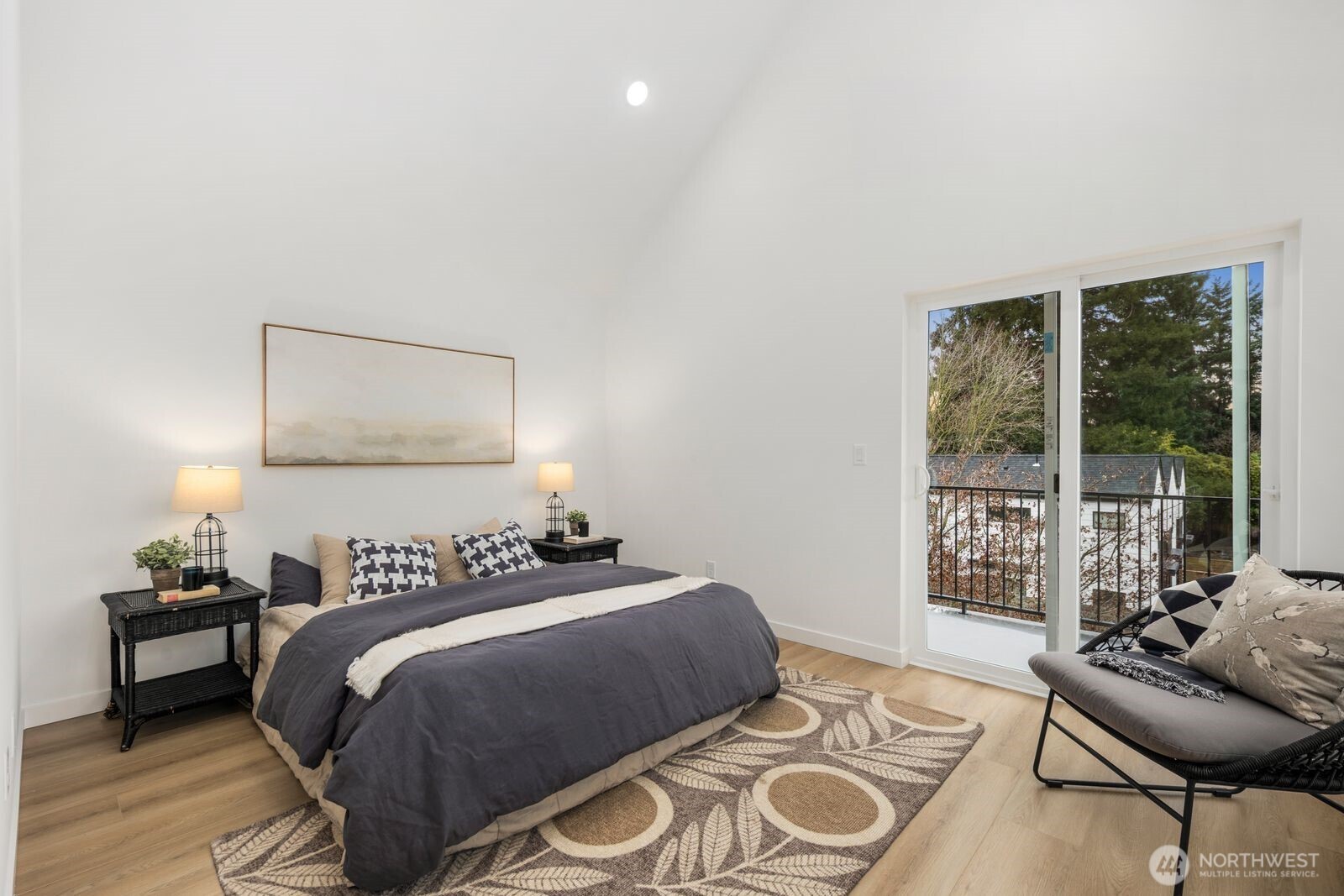 806 South Rose Street Seattle, WA 98108 - Photo 13 of 20 a bedroom with a bed and wooden floor