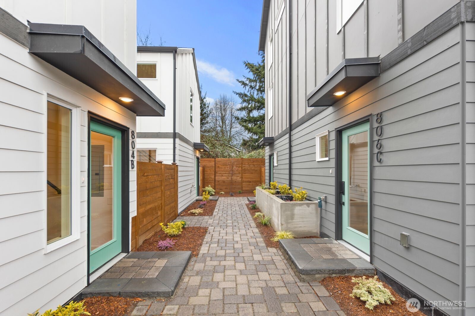 806 South Rose Street Seattle, WA 98108 - Photo 3 of 20 a view of a patio with a table and chairs and wooden floor