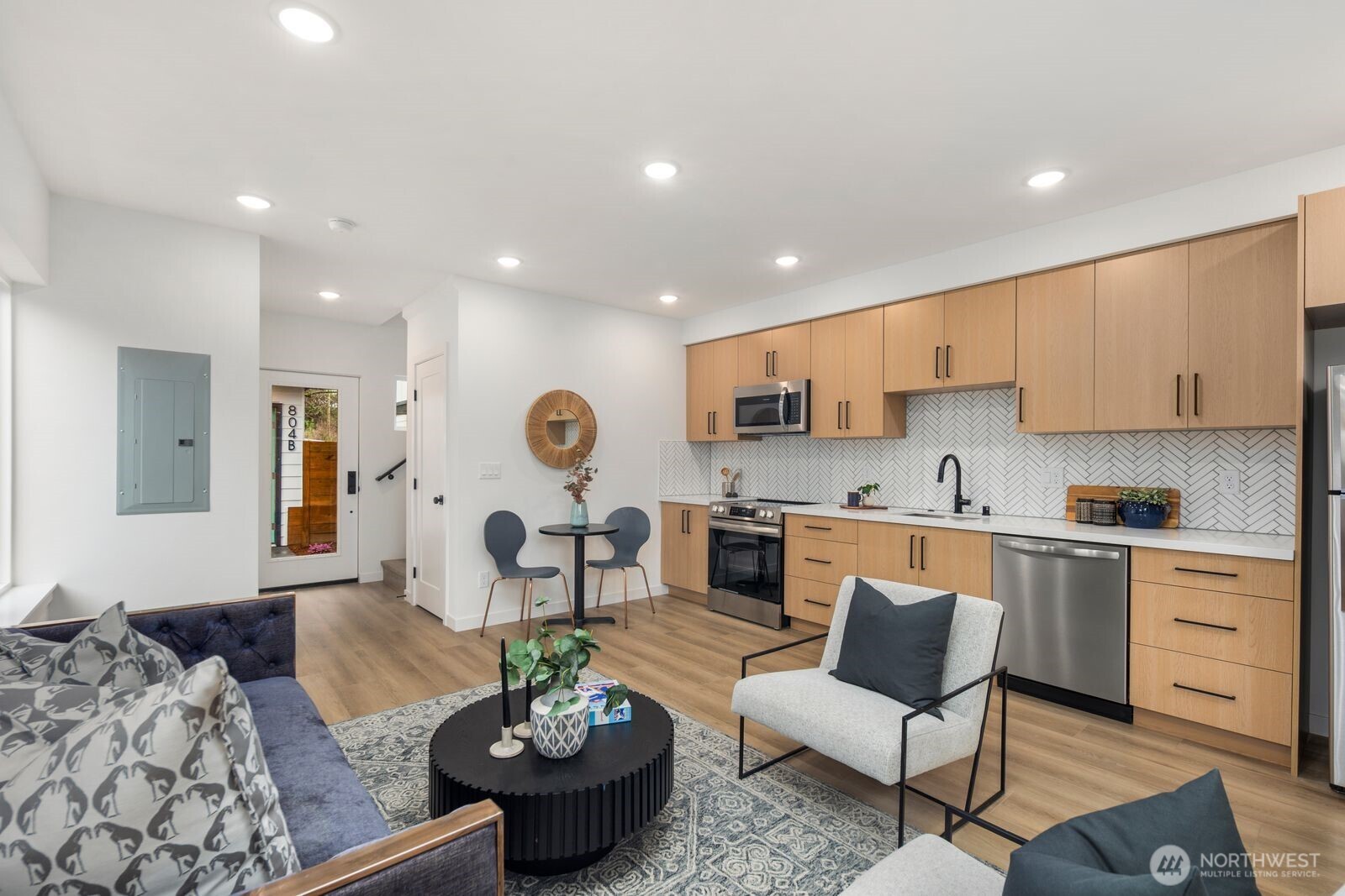 806 South Rose Street Seattle, WA 98108 - Photo 7 of 20 a living room with furniture and a view of kitchen