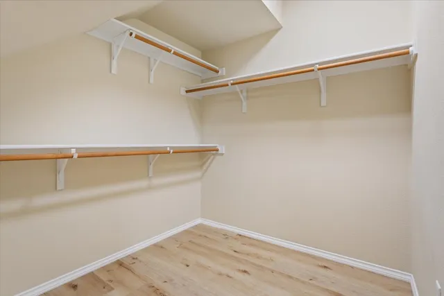 a view of an empty walk in closet