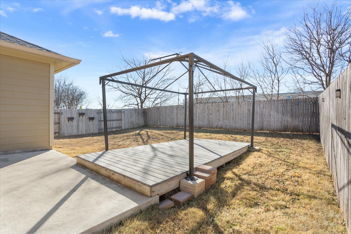 1024 Chad Loop Round Rock, TX 78665 - Photo 26 of 29 Wooden terrace featuring a fenced backyard and a patio area