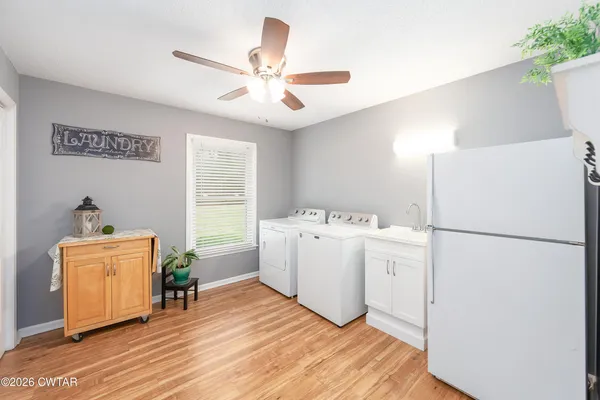 a view of kitchen with furniture wooden floor and window