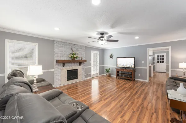 a living room with furniture and a fireplace