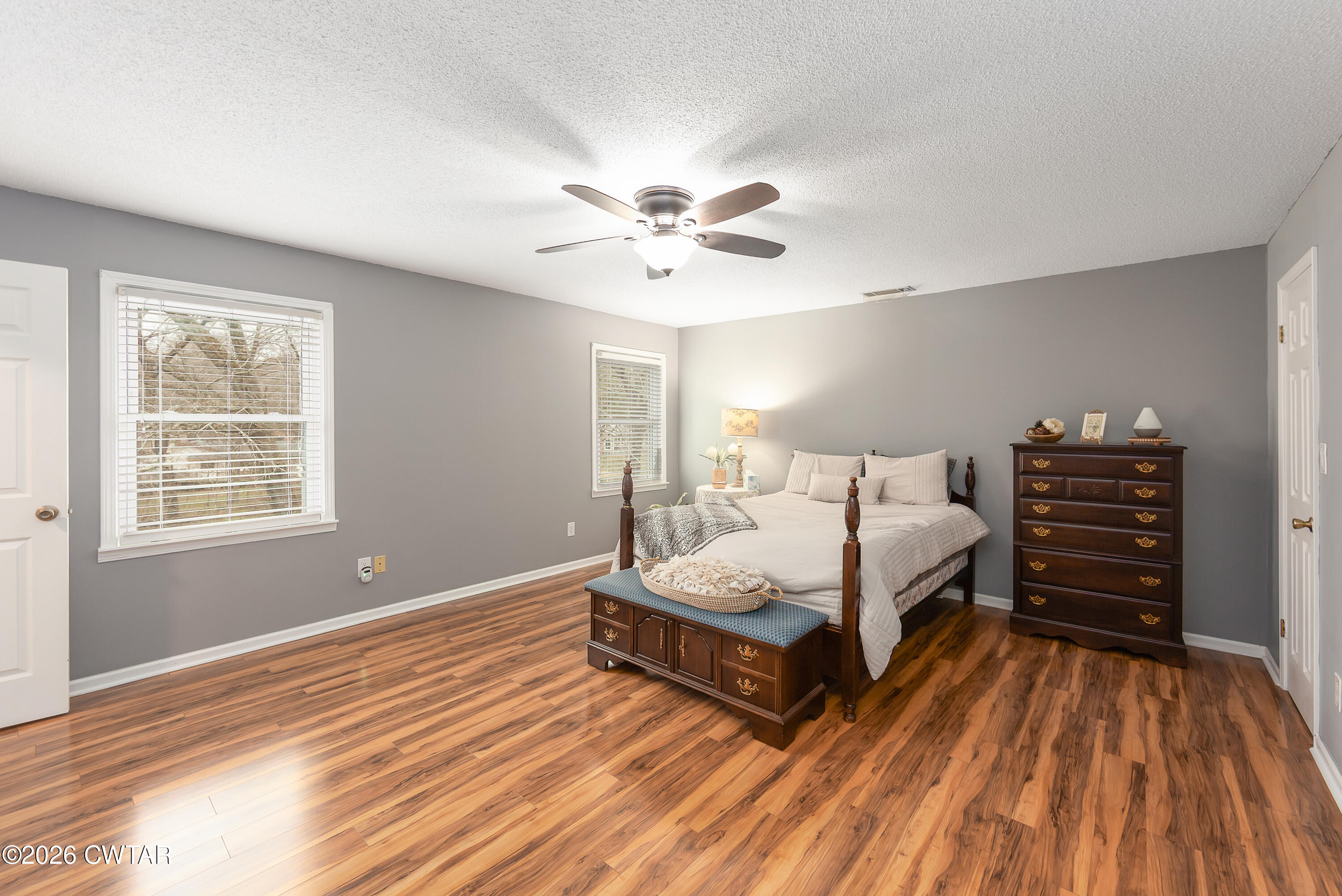 359 Old Bells Road Jackson, TN 38305 - Photo 22 of 40 a spacious bedroom with a bed and a ceiling fan