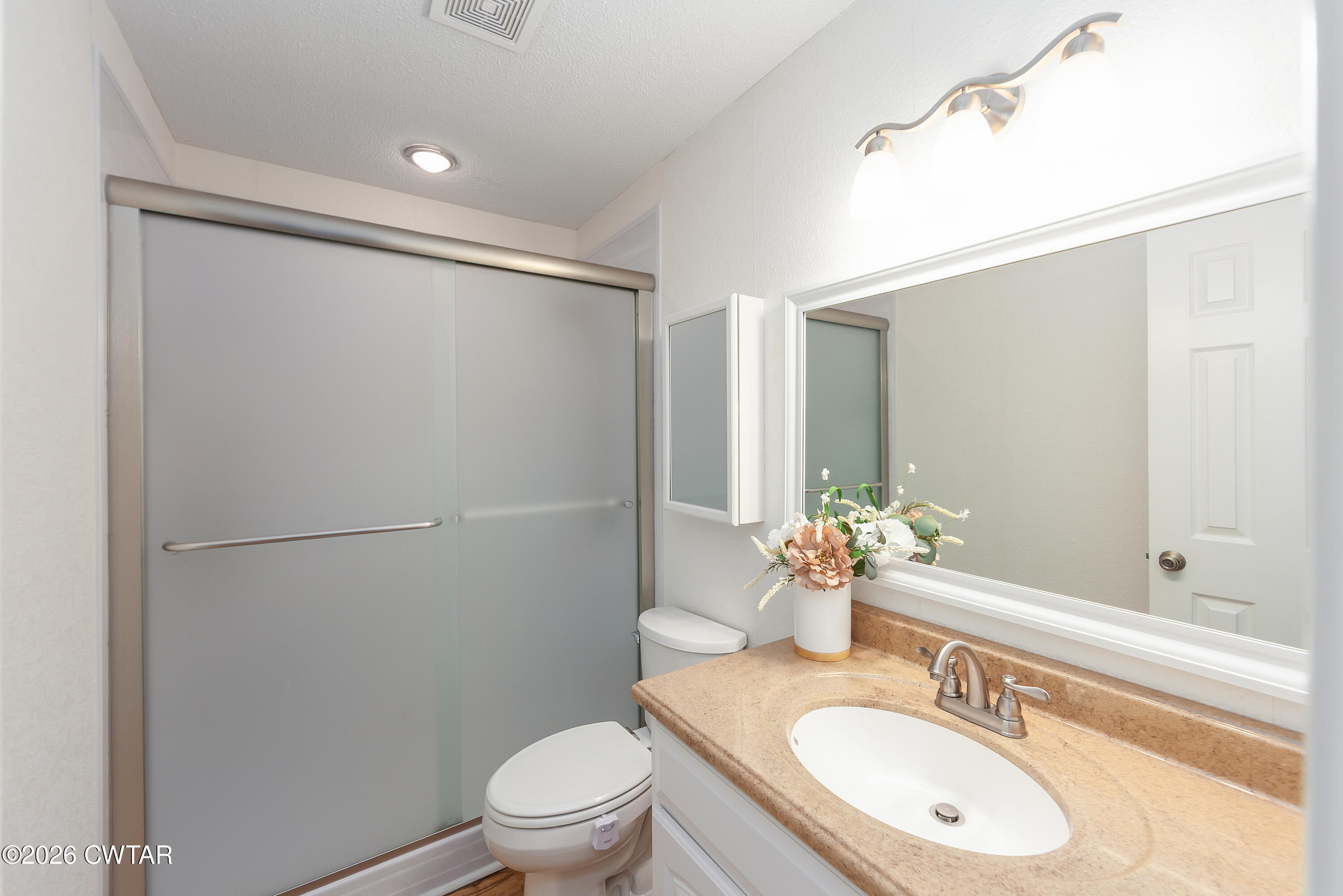 359 Old Bells Road Jackson, TN 38305 - Photo 24 of 40 a bathroom with a sink toilet and shower