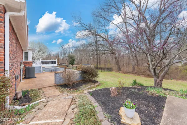 a view of a backyard with sitting area