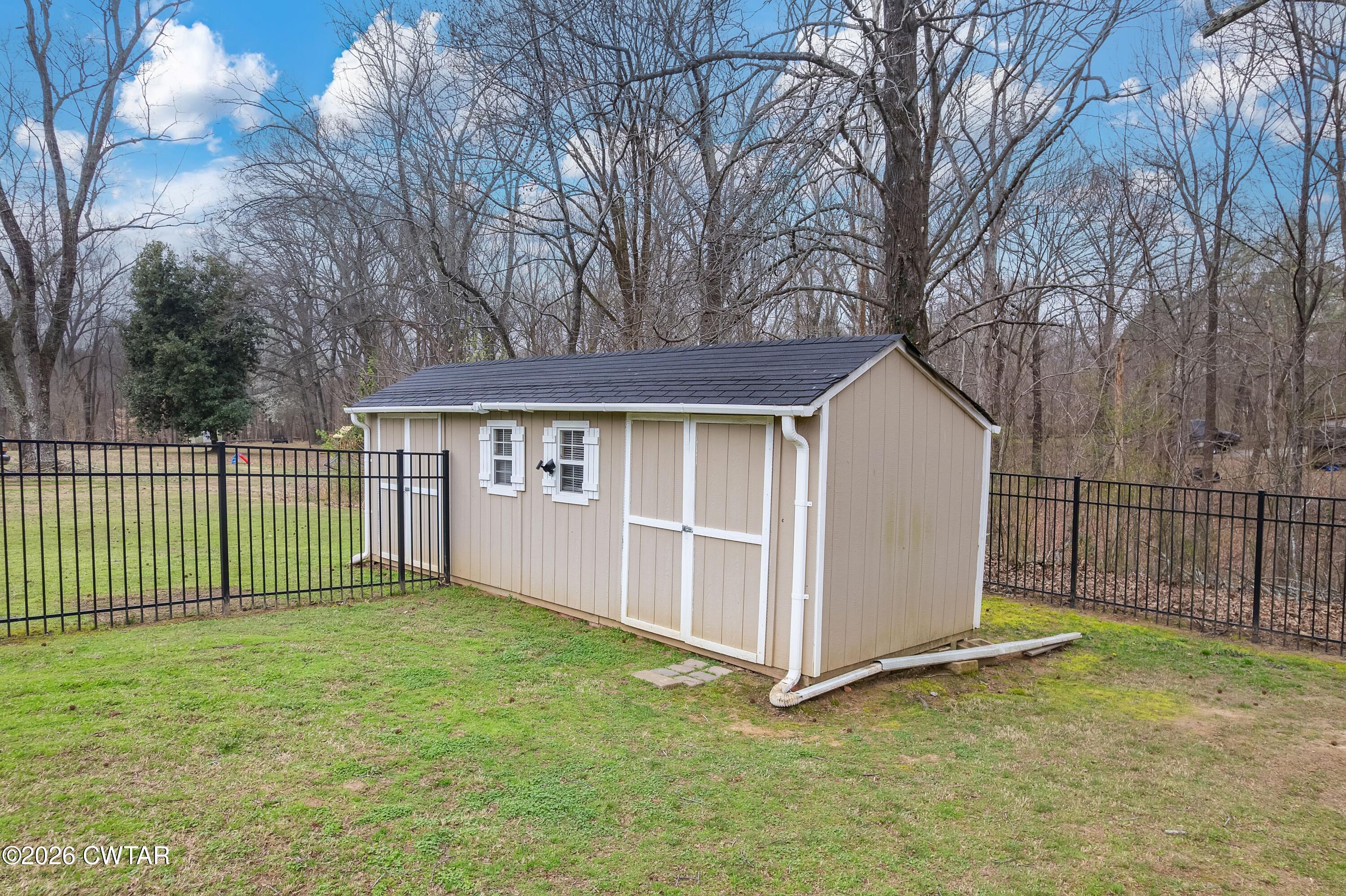 359 Old Bells Road Jackson, TN 38305 - Photo 35 of 40 a view of a house with a backyard and a garden