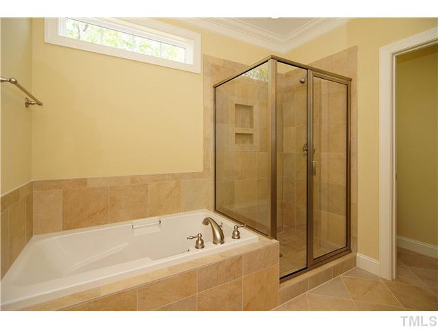 204 Redhill Road Holly Springs, NC 27540 - Photo 13 of 25 Tiled Spa-style Bath, double vanities, separate tub and shower Master Bath/Spa